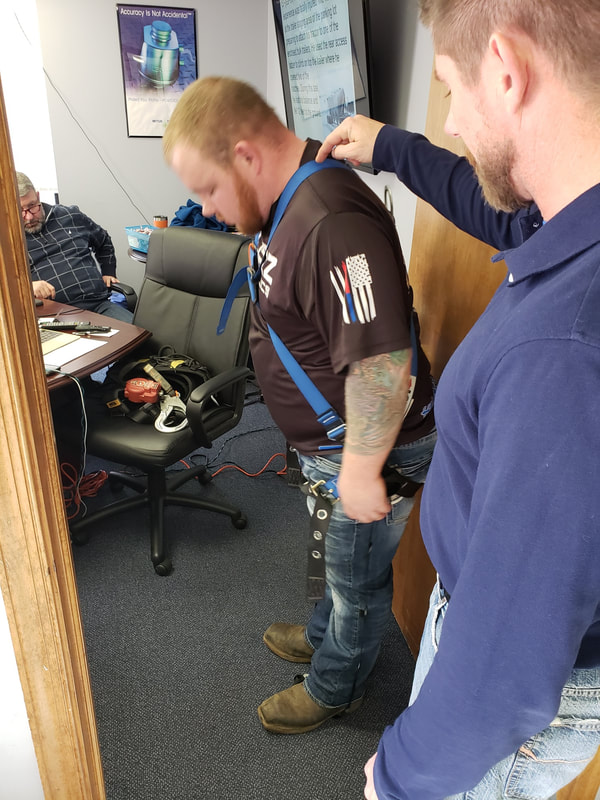 Joe going over some fall arrest equipment.